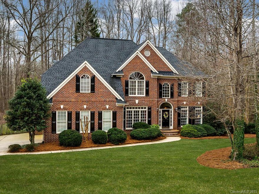 5 bed/4full bath brick home in desirable Davidson River Run.  Move-in ready with new carpet and paint! Ideal half acre cul de sac lot within easy walking distance of pool or golf.  Lovely stone fireplace in den with lots of windows overlooking  wooded completely private backyard. Built-in bookcases in library, updated kitchen with granite countertops.  Dining room with butler area. Unfinished third floor with fixed stairs.