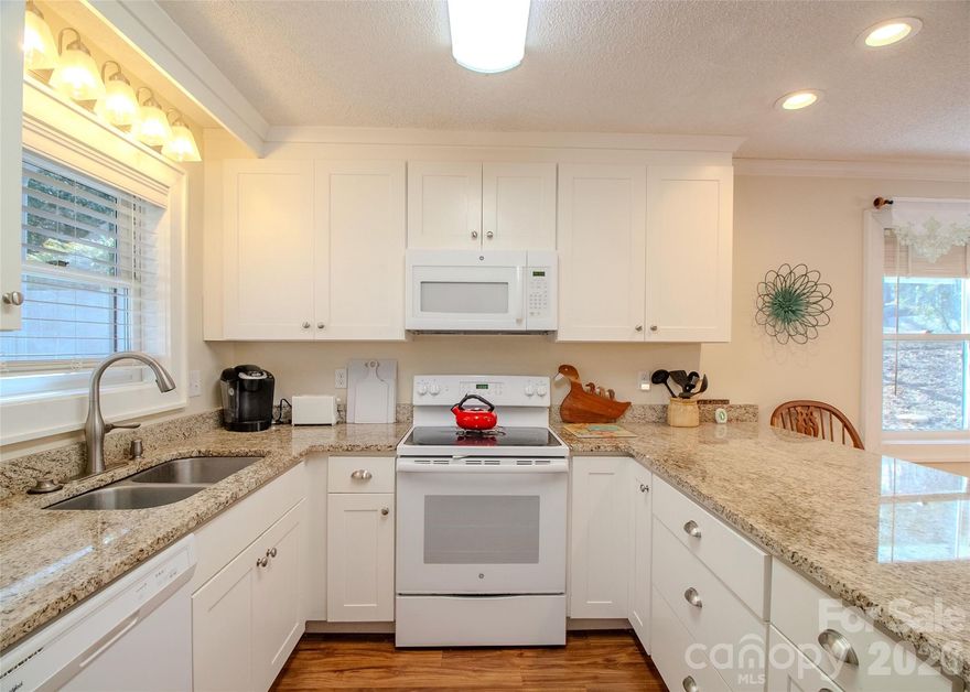 THE BEST VALUE IN LAKE JUNALUSKA! Welcome to your Tri Vista retreat in the Lake Junaluska community—where low maintenance comfort meets mountain charm. Priced to sell, this inviting 3-bedroom, 2-bath condo features spacious open-concept living, a kitchen with granite countertops, and a cozy wood-burning fireplace perfect for cool mountain evenings. A NEW HEAT PUMP HVAC provides efficient year-round comfort. Enjoy peaceful mornings on the back porch overlooking the pond, or take a relaxing hike around scenic Lake Junaluska trails a short walk away. Conveniently located near Waynesville, shopping, dining, medical facilities and outdoor recreation, with the Great Smoky Mountains National Park and Asheville nearby for endless adventure. Most furnishings convey, making this a low maintenance, turnkey opportunity for a primary residence, getaway, or investment. Short-term rentals permitted and two parking spaces and a storage area included.

This is more than a condo—it’s a lifestyle. Make Tri Vista your home today.