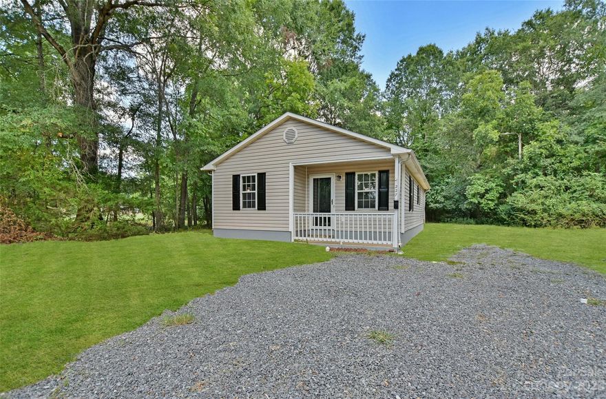This great ranch home with covered front porch is located near downtown Rock Hill and local university. Freshly painted with neutral color palette. Updated flooring, new lighting and new fixtures throughout. Living room is open and bright with natural lighting. Kitchen has all new stainless appliances, breakfast bar and dining area. All bedrooms area roomy and main bath has newer tile flooring. Large back yard is private and backs up to woods and ready for playtime and your furry friends. Move in Ready!