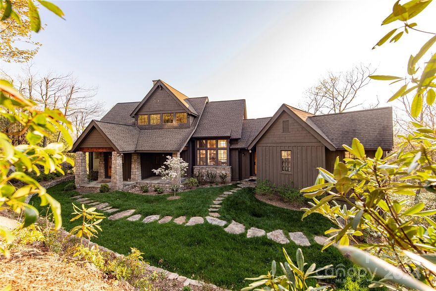 Designed by noted architect Meyer Greeson Paulin, and Benson. This meticulously crafted 4 BR, 3/5 BA custom home on Toxaway Mountain features a large, light-filled great room with a stone fireplace and sweeping views of the Blue Ridge Parkway and surrounding mountains, a beautifully and well appointed kitchen, main floor primary suite with vaulted ceilings, large screened porch with wood-burning fireplace, three well-appointed guest bedrooms, private office, newly constructed two-car carport, new roof, and driveway scheduled to be freshly paved in October. This home also includes the adjacent lot 28 for additional privacy.