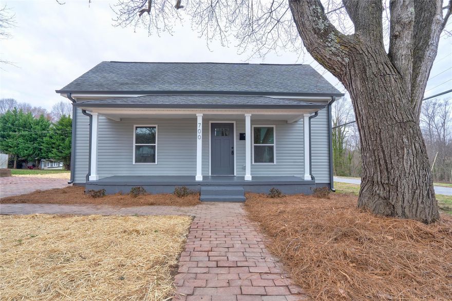 BACK ON MARKET WITH NO FAULT TO SELLER. SELLER OFFERING $3000 TOWARDS CLOSING COSTS WITH ACCEPTABLE OFFER. LISTED AT APPRAISED VALUE. Pack your bags this home has everything you have been looking for and priced at an unbelievable price! The sellers didn't miss anything getting your new home ready for you! This bungalow is the perfect home conveniently located to downtown Cherryville. Once you walk thru the doors at 700 Maple St you will be in awe at the arched entry ways and 10 ft ceilings. Your primary suite features the black barn door leading to your en suite bathroom. New tankless water heater, new AC, new gutters, new siding, new paint, new appliances, new electrical, new plumbing, and new flooring throughout. Make your dinner plans on your back deck or front porch and sit back and relax!