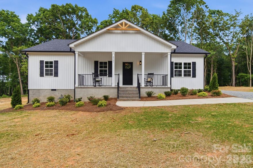 Brand New Construction on 1.5 Acres in Marshville! Enjoy the privacy and flexibility of country living while still being just a short drive to Monroe and the bypass. This newly built 4-bedroom home sits on a spacious 1.5 acre lot tucked off a quiet road with plenty of room to add a future garage, shop, or outdoor space.
Inside you'll find an open concept layout with 9-foot ceilings, upgraded soft-close cabinetry, granite countertops, and waterproof laminate flooring throughout the home. This floorplan offers privacy for the primary suite while keeping the living, dining, and kitchen spaces open and functional for everyday living or entertaining. Additional bedrooms and flex space offer a wide range of use to give the homeowner incredible flexibility and storage capacity.
The rocking chair front porch welcomes you home, while the large lot offers endless possibilities with little restrictions and county-only taxes. A one-year builder warranty provides added peace of mind for the new owner.
If you're looking for new construction with land, privacy, and room to grow, this home checks all the boxes.