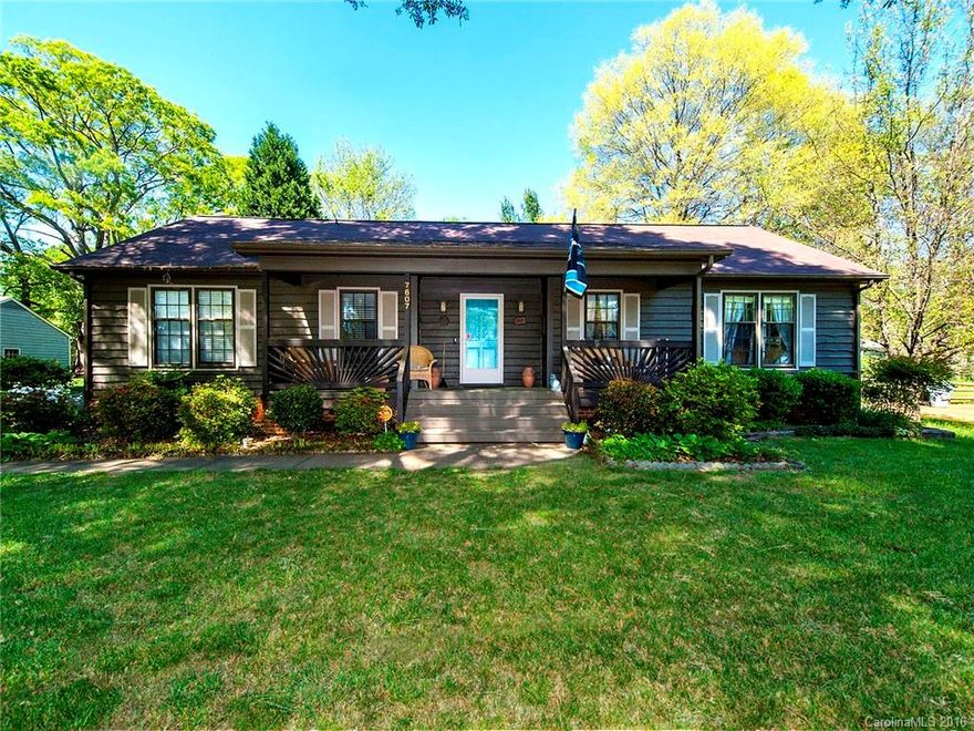 Rocking chair front porch, charming glassed sunroom (not in HTAR but perm natural gas heater) & 700+ ft. two car garage not to mention sought after school assignment say HURRY.  Granite counters baths & kitchen.  Cathedral ceiling great room leads to awesome sunroom overlooking fenced backyard.  Hardwood floors in entry, great room; Pergot type hall and master BR.  Roof & DW approx. 5 yrs, old. Gas pack about  8. Crown molding in every room. 
Only one step in back to gain entry.