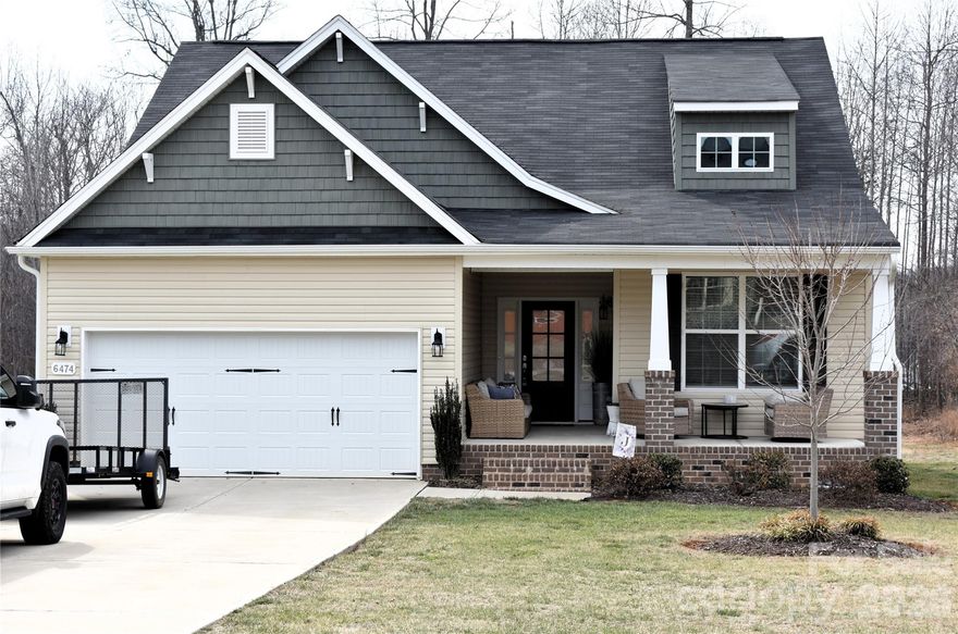 Welcome to this beautifully maintained Somerset III floorplan in the Rogers Farm subdivision. Built in 2022, this 3-bed/2-bath ranch offers modern comfort, thoughtful design, and an abundance of natural light. Enjoy a spacious kitchen featuring stainless steel appliances, granite countertops, and an open layout that flows seamlessly into the main living areas. Tray ceilings add an elegant touch, while the inviting sunroom provides the perfect place to relax or entertain year-round. The primary suite includes a well-appointed bath and generous closet space. With its contemporary finishes, single-level living, and convenient location, this home is truly move-in ready. Deck off of the Sunroom. Located just 15 minutes from the Toyota Battery plant. Offers convenient access to major highways including NC-62, and US-421, placing downtown Greensboro about 20 minutes away. Enjoy nearby Hagan Stone Park and Forest Oaks Country Club.