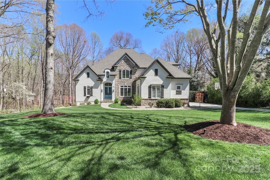 Nestled in the highly sought-after The Point, this stunning 2-story basement home offers the perfect blend of luxury, comfort, and modern updates. The impressive 2-story great room is flooded with natural light, highlighting an open floor plan and picturesque backyard. A custom walk-in pantry adds convenience to the beautifully updated kitchen, while the screened porch and maintenance-free decking provide seamless indoor-outdoor living. The private yard, surrounded by a canopy of trees, offers direct access to a scenic walking trail, creating a peaceful retreat. With an assigned boat slip granting easy access to Lake Norman, this home is a dream for water enthusiasts. Major updates—including HVAC, roof, water heater, and exterior paint—have all been completed within the last four years, ensuring worry-free living. This exceptional property is the perfect balance of elegance, functionality, and prime location near the community amenities - tennis, outdoor pool, & Trump Int'l golf club.