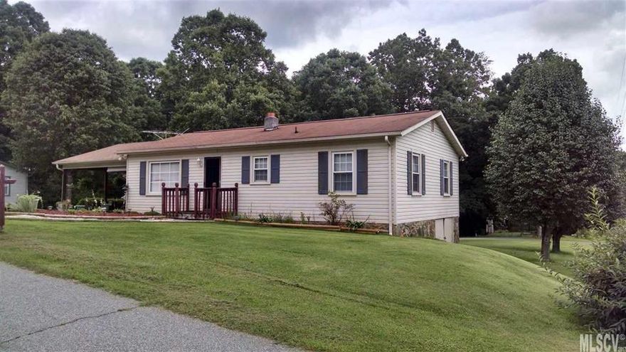 Feel like you are in the country, but just minutes away from Hwy 321 and up-town Lenoir. Well maintained home on a quiet street & corner lot. Great starter home or "down sizer".  All one level living. You will love relaxing on the Covered Deck, perfect for entertaining or chilling in the shade. Bedrooms are big enough for king size bed & large dresser. Spacious living room. Storage building/garage with concrete floor & in good condition, plus has its own drive way. Basement has dirt floor with black plastic covering most of it & tall enough to stand up, good space for storage. Move in ready. Don't miss out on this little gem.