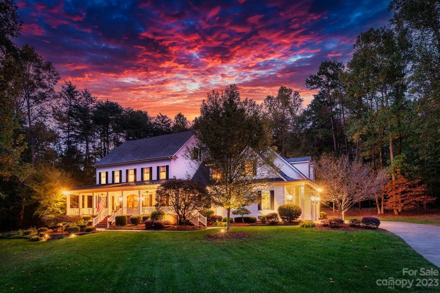 Nestled on a lush 2.87-acre lot surrounded by trees, this custom-built, two-story farmhouse offers the ultimate blend of luxury and pastoral tranquility in a sought-after equestrian community. Just minutes from an elite equestrian center, shopping, major freeways, and vibrant Charlotte, its prime location is unrivaled. A stunning full wraparound porch with brick-lined flooring welcomes you, perfect for savoring views of horses on the nearby trail. The main floor is a masterclass in design, featuring a primary bedroom, spacious living areas, and a gourmet kitchen with woodland views. Additional amenities include a 3-car garage, mudroom, and main floor office. Upstairs, find three large bedrooms, a bonus room, a second office area, and another laundry room. Impeccable attention to detail elevates this home into a class of its own. Options for a Country Club close by is the beautiful River Run Country Club and the Northern Reginal Recreation Center that offers all kinds of activities.