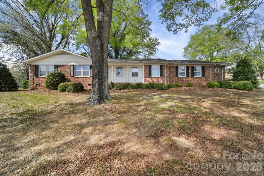 This rare 1.2-acre multi-use property, just 2 miles from Union County, offers exceptional investment potential with a one-owner full-brick ranch home that has been tastefully updated throughout. The main residence features a newly renovated kitchen with modern cabinetry, countertops, backsplash, and stainless-steel appliances, along with updated baths, spacious living areas, a brick-paver sunroom, abundant storage, and an oversized garage. A detached studio apartment with its own 2-car garage adds valuable flexibility for rental income, guest use, or on-site workspace. Grandfathered as residential but zoned Highway Business, the property opens the door to a wide range of commercial or mixed-use possibilities, making it an ideal opportunity for investors, entrepreneurs, or those seeking a live-work setup with room to expand. MLS commercial listing #4364961