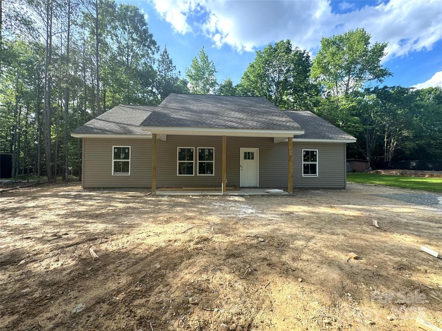 Welcome to this stunning new construction home in the charming town of Mount Gilead w/ NO HOA! Step inside to an open floor plan w/ 9-foot ceilings, luxury quartz countertops, & an upgraded appliance package, perfect for entertaining and everyday living. You'll notice the craftsmanship and attention to detail throughout, including solid wood cabinets w/ soft-close drawers & doors, plus 42” upper cabinets. The bathrooms continue to impress with elegant tile showers. The owner's suite is a true retreat, complete w/ walk-in closet and double sink vanity in en-suite bathroom. Additional features include utility wash sink in laundry room, wire shelving in bedroom closets, & lovely bathroom mirrors. In the area, you will find many ways to explore nature including the breathtaking Uwharrie Mountains and Lake Tillery. Located 1 mile from local elementary school, nearby coffee shop and shopping, this home combines comfort, style, and functionality in an unbeatable location! Don’t miss this one!