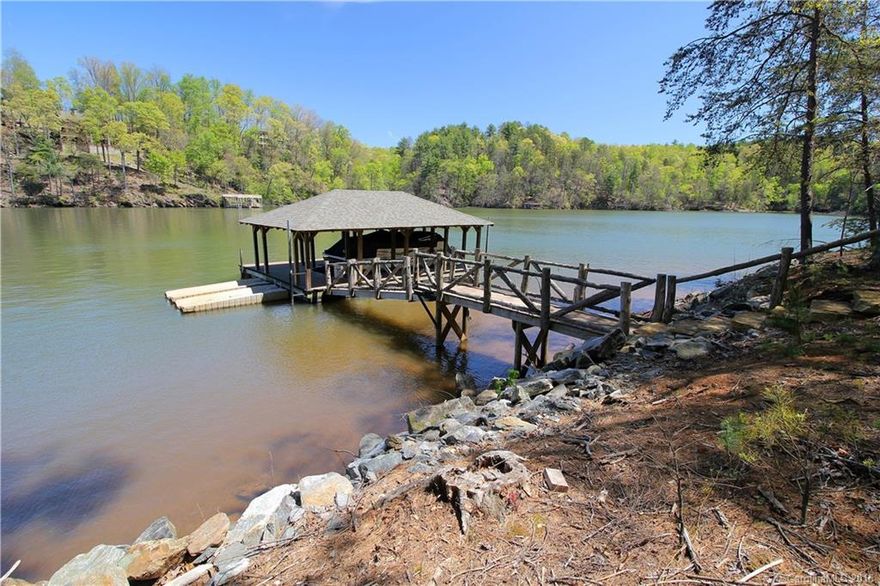 Incredible lakefront home on over 3 acres with beautiful views from every window.  Located in the gated community of Black Forest which has great amenities, walking trails, full-time caretaker and heli-pad.  Additional homes are allowed on the 3 acres.  Come visit paradise!  Easy access to lake and dock.