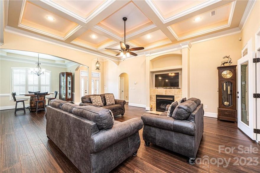 BETTER THAN NEW AND SITTING ON DOUBLE LOTS IN ABERNETHY PARK (THE RESERVE). This Custom Built home has over 3200 Heated Sqft. The Main Level offers an Open Floor Plan with Kitchen/Great Room/Dining combination. Perfect for entertaining friends and family. The kitchen has Granite Counters, Tiled Backsplash, Custom Cabinetry, Large Island, Pantry, Breakfast Nook & Separate Dining Area. Beautiful, Lighted Coffered Ceilings in the Great Room with a Gas Log Fireplace. Engineered Hardwoods throughout the home. Travertine Stone in the Bathrooms, Sunroom and Foyer. Split Bedroom Floor Plan. Primary Suite with Lighted Dbl Tray Ceiling. Spacious Bath with Jetted Tub, Large Walk in Closet. Upstairs gives you the extra room every family looks for with a large Bonus Room, plus an additional room that could serve as a Bedroom or Office, Full Bath. Cul-de-Sac Location. Oversized Double Garage with 782sqft. Extra Concrete poured for extra parking to the right of the driveway. Corner Lot .94 Acres.