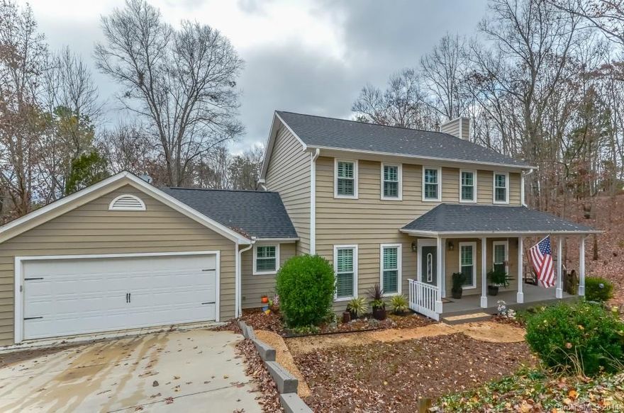 Situated on a 1 acre wooded lot, this wonderful Tega Cay home features 4 BR & bonus room, hardwood floors, a large Chalet inspired addition, and a custom kitchen with many unique touches that include granite counters, stone backslash, and premium stainless steel appliances.  Enjoy cozy nights by either of the two stone fireplaces, or perhaps some rest and relaxation on the large outdoor deck.  New roof installed in 2011, siding and windows in 2012. Many other unique touches that have to seen!