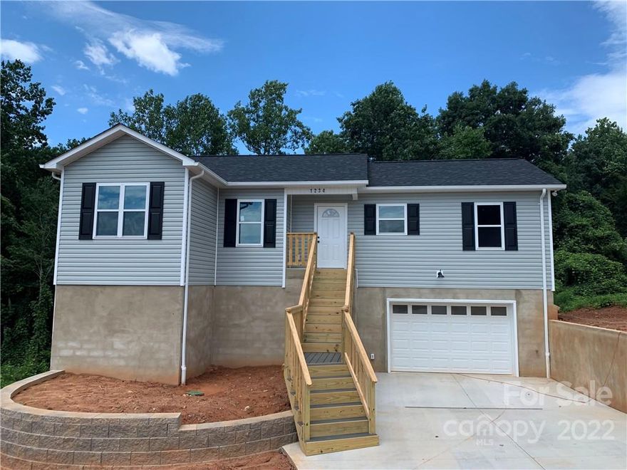 New Construction!  Huge basement!  Conveniently located between Hickory, NC and Morganton, NC right off of Hwy 70 in Catawba County.  Every inch of this new home is perfectly appropriated for maximum utilization.  Split bedroom layout is separated by an open living room and dining area.  Slide open the doors onto the back deck and it feels like you are sitting in a tree house!  Beautiful wide driveway leads into an oversized 2-car garage. An additional 534 square feet in the basement could be used for anything you can imagine - wine cellar, home gym, theater room, storage, you name it!  Who loves a laundry ROOM?   This house has one!  Home comes with a One Year Warranty directly from the builder!
