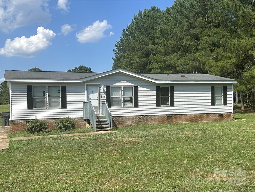 With just a little time, effort, and updates, this double-wide will make the perfect home. It is located in a highly sought-after area of Anderson; just a short drive from McFall's Landing and Pine Lake Golf Club. Sitting on a half acre of land in a quiet, safe community, this three-bedroom and two-bathroom house is ideal. The fireplace in the den makes for the perfect place to relax and unwind after a long day. The large yard is great for entertaining and hosting guests. With a little TLC, this property can become someone's dream home.