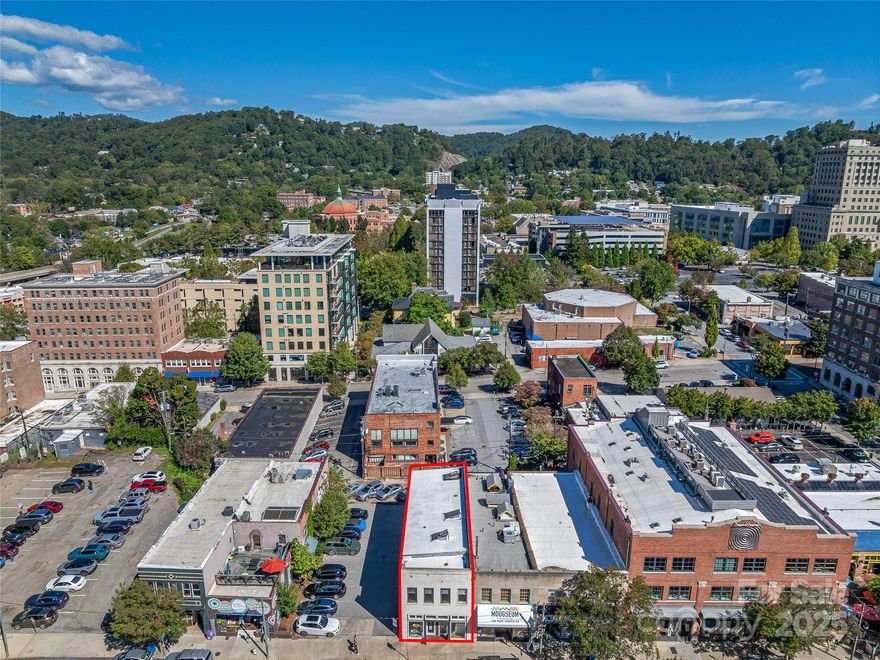 Excellent downtown Asheville investment: 58 Broadway St offers 3,531 SF of finished mixed-use space plus a 1,697 SF unfinished basement. The first floor includes a ~400 SF commercial storefront (with mini-split HVAC and its own bathroom) flanked by two apartment units; the second floor houses three additional one-bath apartments, each outfitted with electric heat, electric range, and refrigerator (no central AC). The building is zoned CBD and serviced by city water and sewer. Strategically located on Broadway Street, which sees approximately 10,000 vehicles per day, the property sits just under a mile from I-240 (Exit 1B / Brevard Rd) and within minutes of the I-26/I-240 interchange, offering seamless access to the region’s interstate network. From this address, residents and tenants can walk to dozens of downtown shops, restaurants, and cultural venues, while vehicles can reach Patton Avenue and Charlotte Street in moments. This property is ideal for an owner-user, rental investor, or owner-operator seeking excellent downtown exposure and connectivity.