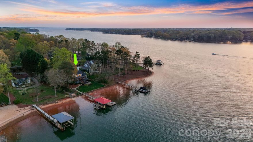 New Price to accommodate for a nice pool!
5 Bedroom House (SEPTIC IS FOR 3: can accommodate 6 people living full time)
Completely reimagined and renovated from top to bottom, this exceptional luxury waterfront estate is tucked away in one of Mooresville’s most coveted and private locations on Lake Norman’s main channel—offering breathtaking views, unmatched tranquility, and incredible proximity to Charlotte. Just 25 minutes to Uptown and minutes to I-77, this is truly a commuter’s dream while still feeling like a private retreat.

What sets this home apart is its rare blend of seclusion, convenience, and thoughtful expansion. Ideally located just 3 minutes to the interstate and Langtree Charter School, and only 5 minutes to Duke Hospital, Lowe’s Corporate Headquarters, and Langtree Village—all within a highly desirable IB school district.

Situated on a level cul-de-sac lot with no HOA, the property offers exceptional flexibility and freedom. The home has been extensively upgraded and expanded to include additional bedrooms and beautifully designed bathrooms, along with a detached two-car garage and a private apartment with its own driveway—perfect for luxurious guest accommodations, multigenerational living, or income-producing potential.

At the heart of the home is a grand, expanded kitchen—truly a culinary dream—designed for both everyday living and entertaining on a larger scale. Throughout the home, you’ll find custom-built cabinetry, abundant storage, and high-end finishes that elevate both form and function.

Inside, the home features 5 bedrooms (3-bedroom septic; see agent remarks), 5.5 baths, and a spacious bonus room. The highly sought-after layout includes a primary suite and a secondary bedroom or office on the main level, offering both convenience and versatility. An impressive 4-car garage—including two climate-controlled bays with a half bath—adds an additional layer of functionality and sophistication.

Every detail has been thoughtfully considered, including a state-of-the-art whole-home water filtration system.

Outdoor living is equally impressive. Enjoy a covered boat dock with lift on the main channel, a screened porch with a double-sided fireplace, and a beautiful stone patio with firepit—all perfectly positioned to take in the expansive water views of Lake Norman.

This is more than just a home—it’s a rare opportunity to own a fully renovated, private waterfront sanctuary in a prime Mooresville location, offering the perfect balance of luxury, accessibility, and lifestyle.
Main House is 4304 sq ft and the apartment is 586 sq ft