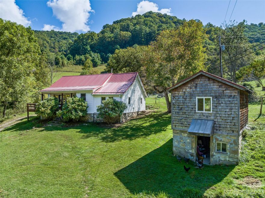 207 Acres in a Private Cove setting only 10 mins from I-26, 18 min to Mars Hill, 30 min to Asheville. Springs originate on the land and flow into several nice creeks on the property. Farmhouse w/industrial Farm Kitchen, Open living/dining room w vaulted ceilings. Opportunities to own land this serene & private are becoming very rare. This property has never been on the open market all together. Graze cattle or horses in acres of pasture & build your dream home in forest selectively timbered w/old logging roads in place leading to multiple homesites. 5 large barns, garden shed, chicken tractor, milk house, detached office, garage/shop, detached craft/guest space, old milk house partially converted to bathhouse, fruit & nut trees: apple, pear, peach, blueberries, blackberries, hardy kiwi, wineberries, woodland medicinals. Homesteaders Dream! You can have it all w this property w tons of space for everything. At under $12k per acre, your only limit is your imagination See also MLS4069075.