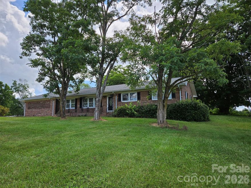 REDUCED!  Welcome to this inviting brick ranch nestled in a serene county setting.  The functional single-level layout is perfect for comfortable living.
Step inside to find a spacious kitchen with ample cabinetry, generous counter space, breakfast bar and room for dining.  
The vaulted great room offers a fireplace with blower, room to entertain guest and access to the 18ft x 19ft sunroom just off the main living area.
The attached carport will accommodate  2 vehicles with room to spare.
The brick 16ft x 24ft storage building with electricity, roll up door and well will make the perfect work shop.  Enjoy the peace and privacy of rural living while being just a short drive from local amenities.
Whether you're looking for a family  home or quiet retreat, this brick ranch offers the best of country charm and modern comfort.  Don't miss your chance to make it yours.