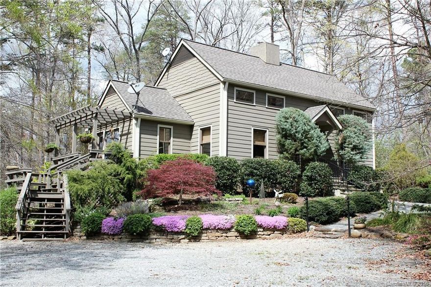 Raven's Call is an enchanting hunt box on 5.15 secluded acres in Tryon's Old Hunt Country. The updated home boasts many architectural flavors including exposed beams, custom iron work/hardware, FP w/hand hewn mantle, antique front door, unique light fixtures, and pine and brick floors throughout. Property is completely fenced with 2 run-in sheds, small lush pasture, sand paddock, creek (on backline), storage barn and dogwash station. Immediate access to FETA trails and only 5 mins to FENCE.