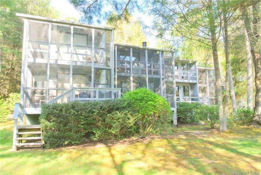 Lake Front Town Home at Connestee Falls a community offering a community center, golf, 4 mountain lakes, parks, hiking trails, pool, tennis. Unit includes new decor scheme, updated kitchen W/Granite,hardwood floors, newer heat pump. new roof 2015, 2 fireplaces large owners quarters. Upper and lower screened covered decks overlooking the lake. Each unit can enjoy there own private dock. Come see why we love living where we play.
