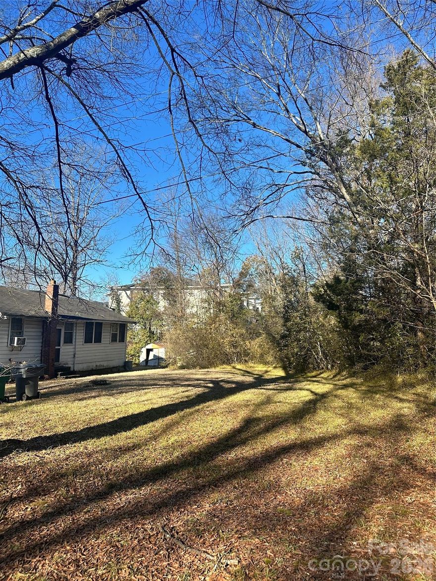 Flat lot on a quiet, cul de sac street. Lovely large oak tree at front of the lot. Located along the hot Wilkinson Blvd corridor just 5 minutes from Charlotte Douglas International Airport and Carolina Golf Club and 10 minutes from Uptown Charlotte. Multifamily zoning. Buyer should conduct all necessary due diligence on the feasibility of the land for buyer's intents and purposes.
