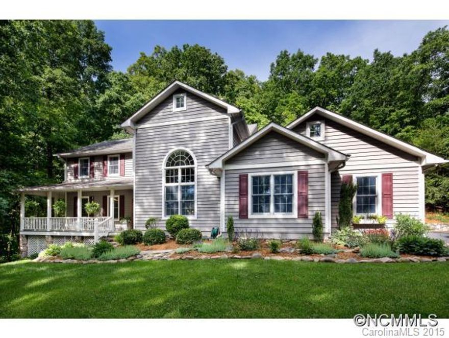 Dream home on 3.66 acre private wooded lot! Hardwood floors throughout & vaulted ceilings. Master on main w/spa-like ensuite. Gourmet kitchen w/granite counters,custom cabinets w/pull-out shelves,stainless steel appliances,gas cooktop,breakfast bar & stone fireplace. Dining/keeping room w/built-ins. Sun room w/2 story stone fireplace, wormy chestnut paneling, native stone floor. Stone fireplace in living room. Patio w/art. waterfall & hot tub.