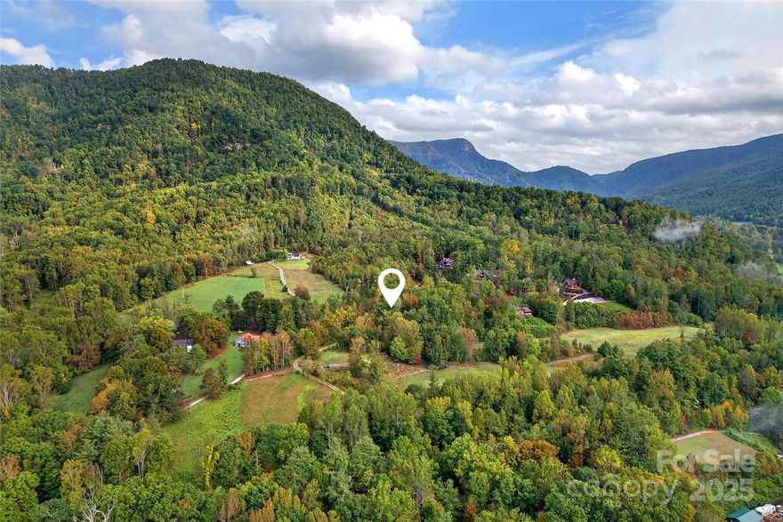 This homesite in Linville Falls Mountain Club offers the perfect canvas for your mountain retreat. Positioned to capture scenic long-range mountain views, the property combines privacy with convenience. The open clearing makes it easy to visualize your home while minimizing site prep. Community features include central water, sewer, and paved roads, all within minutes of Linville Falls, Blue Ridge Parkway, and Pisgah National Forest. Whether for a cabin, vacation getaway, or full-time residence, this is a rare chance to secure a scenic, ready-to-build lot in one of WNC’s most desirable mountain communities. A rare bonus — the property borders the community’s championship disc golf course, offering a unique outdoor lifestyle right from your backyard.