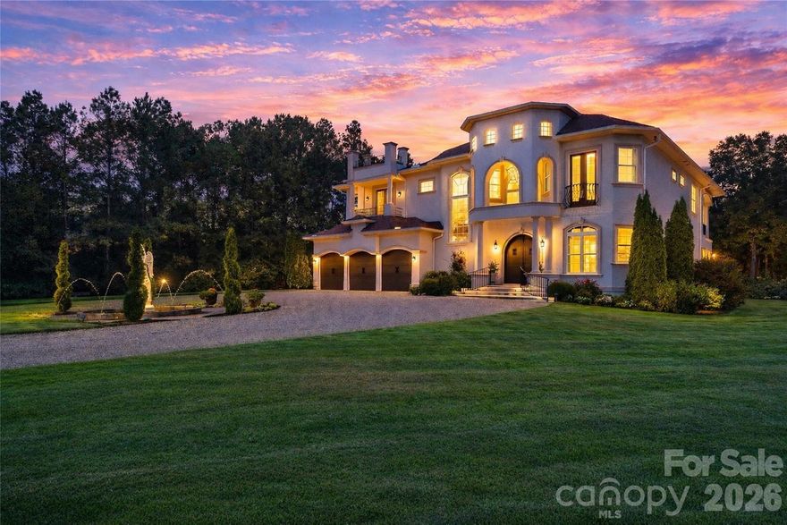 Set on more than 36 acres of rolling countryside, Belle Tesoro offers a rare opportunity to own a private estate designed for those who value space, seclusion, and control over their surroundings. Positioned just outside Spartanburg, the property delivers a level of privacy and scale that is increasingly difficult to find—where the approach itself, a gated and tree-lined drive leading to a circular motor court and fountain, immediately establishes a sense of arrival that is both refined and removed.

The estate encompasses over 5,100 square feet of thoughtfully designed living space, where soaring ceilings, natural light, and custom millwork create an atmosphere of quiet sophistication. A dramatic sweeping staircase anchors the main level, complemented by a layout that balances everyday functionality with the ability to host and entertain with ease. The chef’s kitchen, formal dining room, and library provide structure and purpose to the home, while multiple fireplaces introduce warmth and character throughout. The primary suite serves as a true private retreat, featuring a spa-style bath, private balcony, and elevated views across the surrounding landscape.

Outdoor living is equally intentional. Covered verandas and expansive patios extend the home into a resort-style setting, centered around a pool and fountain framed by manicured grounds and mature landscaping. Beyond the immediate homesite, the acreage opens into a blend of cleared pasture and wooded privacy, offering flexibility for a range of lifestyle uses—from recreational enjoyment to agricultural pursuits (see tax records for land designation).

For buyers seeking a property that prioritizes privacy over proximity and land over density, Belle Tesoro represents a compelling alternative to traditional luxury offerings. It is a residence defined not only by its architecture, but by the freedom and space it provides—an estate environment designed for long-term living, personal vision, and a level of separation that cannot be replicated in more conventional settings.