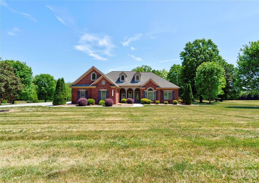 Gorgeous 3BR 2.5BA brick home on a corner lot in The Pointe subdivision near Moss Lake. This home has it all! Gleaming hardwoods. Vaulted ceilings & all others are 9'. Granite countertops. LR has vaulted ceiling & gas log fireplace. Custom kitchen with stainless appliances, granite counters pantry, breakfast bar & brick-like backsplash. Breakfast area & formal dining room with trey ceilings. Split bedroom plan. Large primary suite has vaulted ceiling, sitting area, huge walk-in closet, granite dual vanity with make-up desk, soaking tub, tile walk-in shower & water closet. Large laundry room with overhead cabinets & fold-down ironing board. Spacious office with vaulted ceiling. Bedrooms 2 & 3 each have walk-in closet & share a jack-n-jill bath with tile walk-in shower & granite counter tops. Large sun room has tile flooring & beaded board vaulted ceiling. Huge bonus room has a large walk-in closet and attic access. Home has a covered front porch (with tile floor), rear deck, rear patio & oversized triple garage. Main level of home has gas heat & the upper level bonus room has a heat pump. There are 2 electric water heaters. Home has a central vacuum & a security system. Refrigerator, washer, dryer, and living room TV remain. This home is truly a MUST SEE! Come make this your new DREAM HOME.