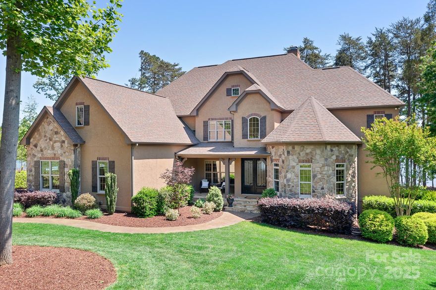 Beautiful WF home in Falls Cove on a level .92 ac lot. Take your 1st steps into the lake from the sandy beach w/231' of waterfront. HUGE WIDE OPEN WATER VIEWS! Show off your skiing skills to family & friends while they watch from shore. There is room for a pool in the backyard if desired. The exterior of the home is hard stucco w/stone accents. Inside this high-end custom home, there are extraordinary features. Upon entry, the Grove Park Inn inspired stone fireplace will catch your eye. The chef's kitchen has a massive island & the breakfast room & formal dining room are close. A 2nd fireplace is tucked away in the front den/office. The luxurious lakeside owner's suite is also on the main level, along w/the laundry room, drop zone, 2 powder rooms, & an oversized 3 car garage. Upstairs, there are 3 bedrooms all with expansive water views, 3 baths, a theatre room w/wet bar & a couple of flex spaces for recreation/2nd office/hobbies or whatever you need! This is phenomenal lake living!