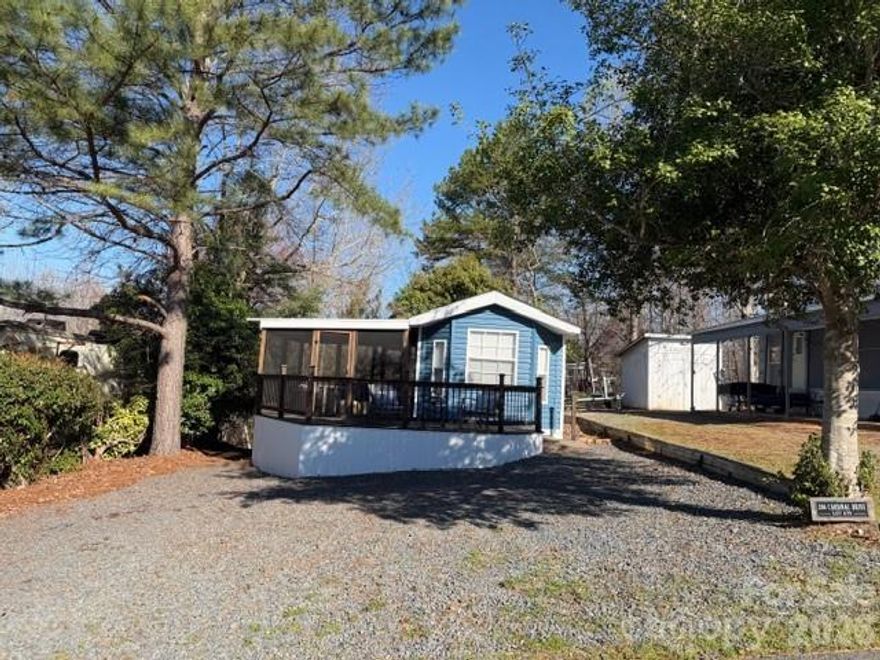 Looking for your dream home at Badin Lake we have a cozy newly remodeled park model with updated appliances, washer & dryer combo, newer rook, screen porch and open back deck nice shady yard with fire pit sitting area, some lake view. This place needs nothing it is so cute and ready to go.  Ship-lap walls with beautiful wooden beam makes you feel like you are in a resort, modern lights thru out very nicely decorated and interior designs were done on this one.  Roof was updated 2023, along with windows, stainless steel appliances and combo washer & dryer included.