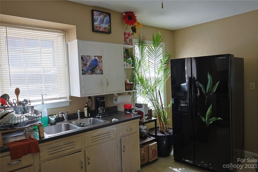 Convenient to shopping, close to Uptown and Freedom Dr., yet nice and quiet residential area. Established back yard vegetable garden. Ideal for first time home buyers. Refrigerator, Washing machine and Dryer. included on the sale price.