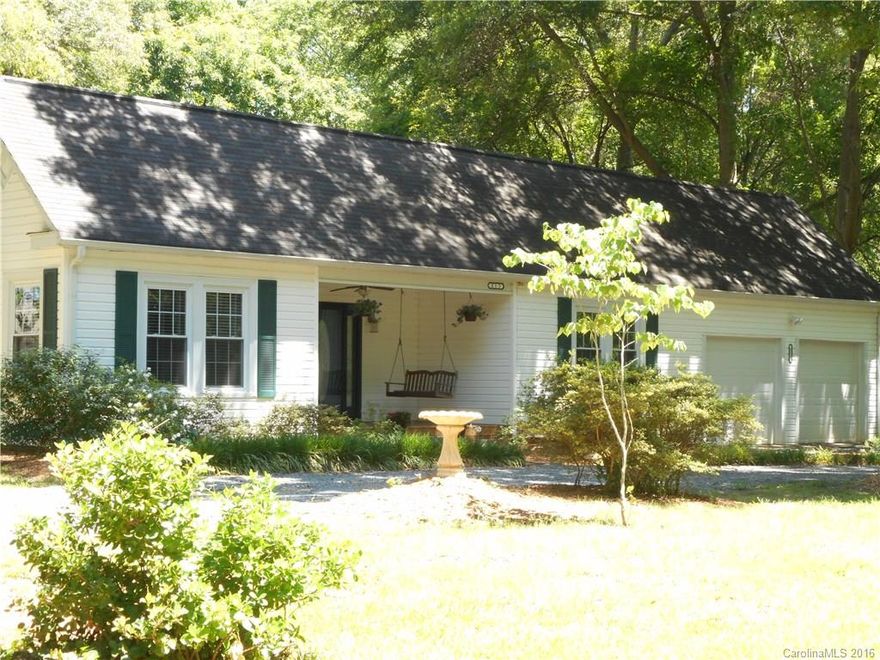 Hard to find ranch in Fort Mill on a one acre lot.  This 3 bedroom/1.5 bath home is adorable. It has real hardwood floors, both bathrooms have been recently remodeled, a large pantry in the eat-in kitchen, a utility room off the kitchen for laundry, and a back yard that cannot be beat!  The over-sized deck has benches for seating, and looks out over the flat tree-filled fenced yard.  You won't be disappointed in this home!