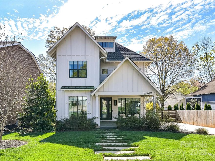 Stunning home in Plaza Midwood is perfect combination of beautiful finishes & terrific living spaces. Built in 2017 as builders personal home filled with custom touches and quality finishes throughout. Light filled open floorplan on the main level with white oak floors, rough hewn ceiling dining room, shiplap in foyer & great room, reclaimed wood vent hood ++. Chefs kitchen w/ amazing stone counters, Bertazonni gas range, Miele Dishwasher, built in microwave, butlers pantry w/ filtered water system & walk in pantry.  Spacious breakfast room & truly wonderful great room leading to spacious rear covered porch w. vaulted ceilings. Primary suite of your dreams w huge closet & spa like bathroom. Guest house built in 2020 w/ 2 car garage +700 sq feet w/ Living/Bed, Office & Full Bath. Convenient touches like collar controlled dog door & electric driveway gate. The storybook backyard is fully fenced has turf for ease, raised bed garden, large patio, adorable playhouse, & privacy landscaping.