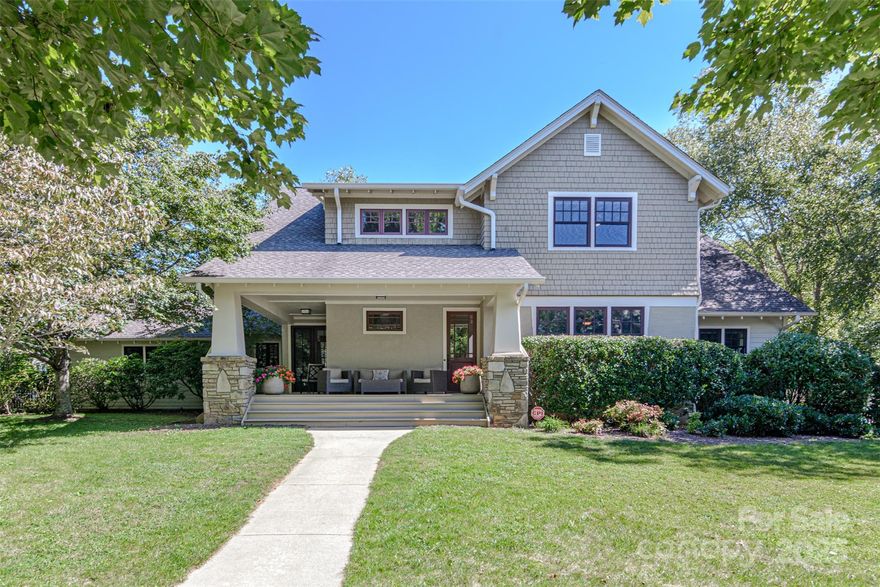 Completely renovated craftsman-style home in the coveted Olmsted section of Biltmore Park blends timeless architecture with modern luxury. The main level features a gourmet chef’s kitchen with soft-close inset custom Crystal cabinetry extending to the ceiling, premium appliances, and leathered granite surfaces on both the oversized island and counters. Additional main-floor highlights include a spacious master bedroom, private office, formal dining room, laundry room with walk-in pantry, and a floor-to-ceiling direct vented stone fireplace in the living room. Hardwood floors run throughout the main floor and the stairwell. Upstairs has three spacious bedrooms, including one with a unique custom-built wood nook. A fifth potential bedroom is built out as a game room.   Situated only three homes from the community pool and a short stroll to bustling Town Square. This property provides effortless access to dining, shopping, and I-26.