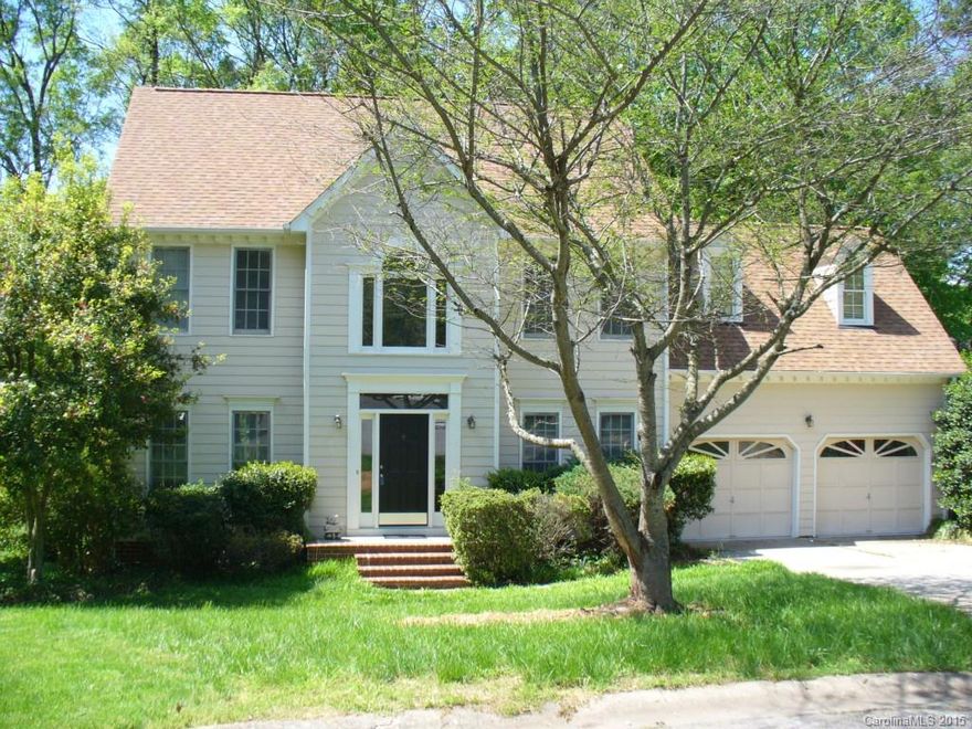 Two story freshly painted with new carpet features four bedrooms, formal living room, dining room with hardwood floors, large kitchen with island and stainless steel appliances. Master bath has dual vaniites separate shower and jetted tub. Located in cul de sac and walking distance to pool. Deck overlooks wooded lot. Other features include two car garage, security system.