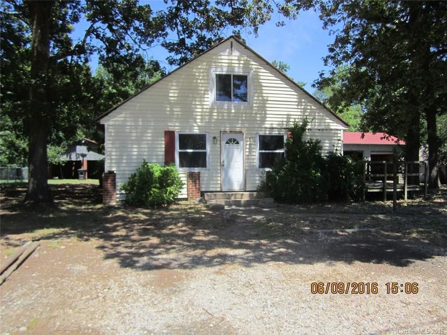 The house has soft flooring, and caution should be taken if looking inside.  There is a shared driveway on the left side that goes back to an old shed, one-half of which is owned by this property.  Previous owner said there is no heat or air.  Buyers should present proof of funds with an offer.