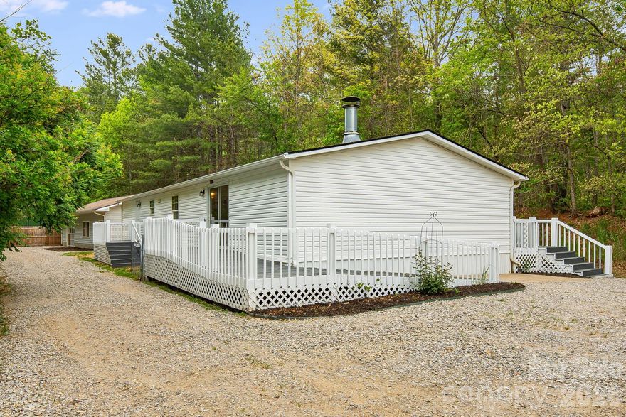 If you’ve been dreaming of mountain views, privacy, and a home that’s already been updated for you—this one is going to feel like the perfect fit.
Welcome to 90 High Point Road in Weaverville, where you’ll find a beautifully refreshed 3-bedroom, 2-bath home sitting on approximately 2 peaceful, wooded acres with stunning long-range mountain views that never get old. Whether it’s sunrise coffee or winding down at the end of the day, the scenery here truly steals the show.
Step inside and you’re greeted with a bright, clean feel thanks to fresh interior paint and brand-new luxury vinyl plank flooring. The layout is comfortable and functional, making it easy to settle in right away. The kitchen has been updated with a new appliance package and countertops, giving you a fresh, modern space to cook, gather, and entertain. Both bathrooms have been upgraded with new vanities, adding a simple but impactful touch of style. And with a brand-new roof already in place, you can enjoy peace of mind knowing the big-ticket items have been taken care of.
Outside, the freshly painted decks are ready for you to relax, host friends, or simply take in the quiet surroundings and incredible views. One of the standout features here is the large detached workshop, offering over 900 square feet of flexible space. Whether you need a garage, a place for projects, extra storage, or even a hobby space, this building opens the door to a lot of possibilities.
The location strikes a great balance—tucked away in a peaceful setting, yet still convenient to Weaverville, Mars Hill, and Barnardsville. You’re close enough to enjoy local shops, restaurants, and everyday conveniences, while still feeling like you’ve escaped to your own private retreat.
This is the kind of property that’s hard to find—updated, well-maintained, with land, views, and usable space both inside and out. It’s ready for you to move in and start enjoying right away.