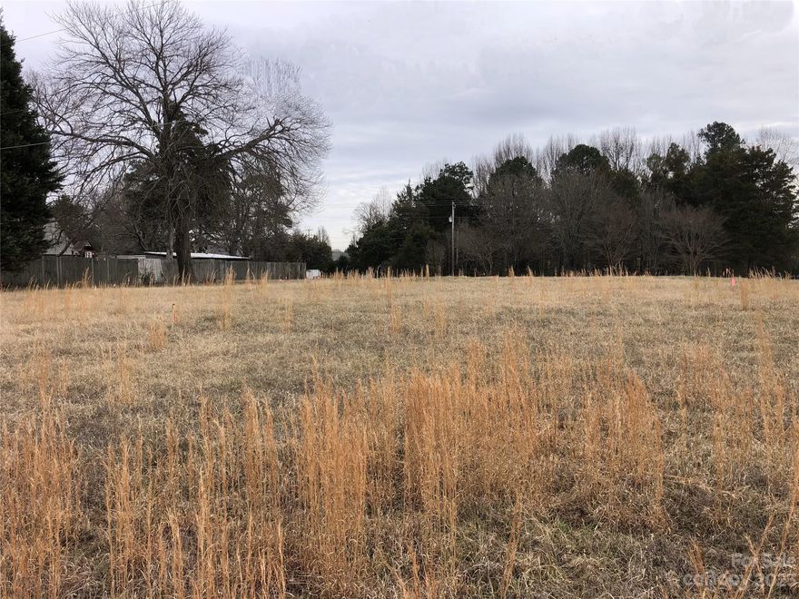 Beautiful 1.4 acre perfectly level lot in Mooresville, nice private location.  Land has been perked for a 3 bedroom home.  No building restrictions. No HOA. Low county taxes.   Close to I-77; schools; shopping.