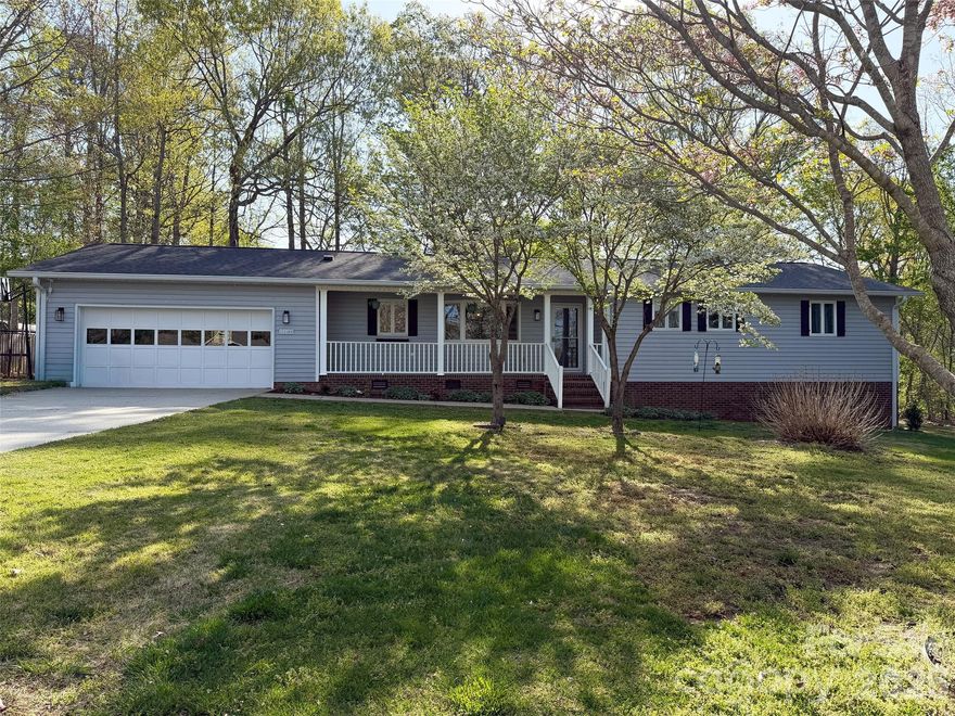 Welcome to Woodland Oaks, where privacy, space, and thoughtful updates come together on a beautiful .57-acre lot with no HOA. This move-in-ready home has been freshly painted throughout, features all redone flooring, and a new HVAC system installed in 2026 — offering both style and peace of mind. A welcoming front porch invites you inside to a bright and comfortable interior. The spacious living room centers around a cozy wood-burning fireplace and opens to the back patio, creating an easy flow for everyday living and entertaining. The kitchen offers granite countertops and a tasteful backsplash. Just off the kitchen, the dining area is highlighted by a charming bay window that fills the space with natural light and creates a warm setting for gatherings both large and small.
The primary bedroom provides a private retreat with an updated en-suite bath, while the additional bedrooms are generously sized and versatile to fit your needs — whether for family, guests, or a home office. Downstairs, the finished basement adds valuable flexible living space, perfect for a recreation room, media area, gym, or playroom. An unfinished section provides excellent storage or the opportunity for a workshop. Step outside to enjoy the fenced backyard and the peaceful surroundings of this expansive lot. With mature trees, added privacy, and no HOA restrictions, this property offers a rare combination of freedom and tranquility.