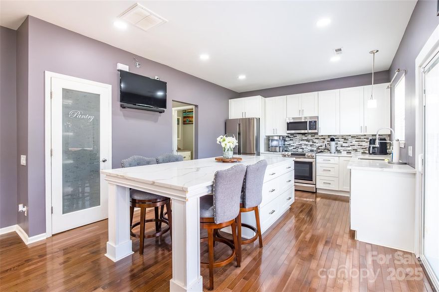 Discover this charming two-story home in the desirable Mulberry Pond subdivision of Charlotte, NC. This well-maintained home offers a comfortable and functional layout perfect for modern living! Throughout, you'll find carefully appointed upgrades! The main level boasts a flowing floor plan, ideal for entertaining and everyday life. A highlight of the home is the spacious kitchen and oversized island, providing a curated space to enjoy! Upstairs, you'll find the private bedrooms, including a comfortable primary suite with vaulted ceilings. Outside, this home features an oversized deck that overlooks a tranquil pond, creating a perfect spot for relaxation or outdoor gatherings. The property also includes a finished garage, creating more entertaining space for your guests!