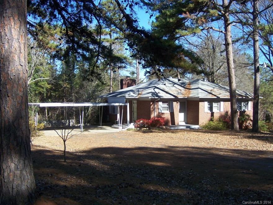 This home offers plenty of privacy (but close to schools) with it's 2.7 acre lot with house centered on property and no neighbors on either side. Large walk-in crawl space provide extra storage or workshop area. This home is "clean as a whistle" with its fresh paint, hardwood flrs, & 2008 HVAC unit. Bathroom is set up like a Jack & Jill bath so it feels like 2 full baths. 100% financing through USDA & no city taxes!