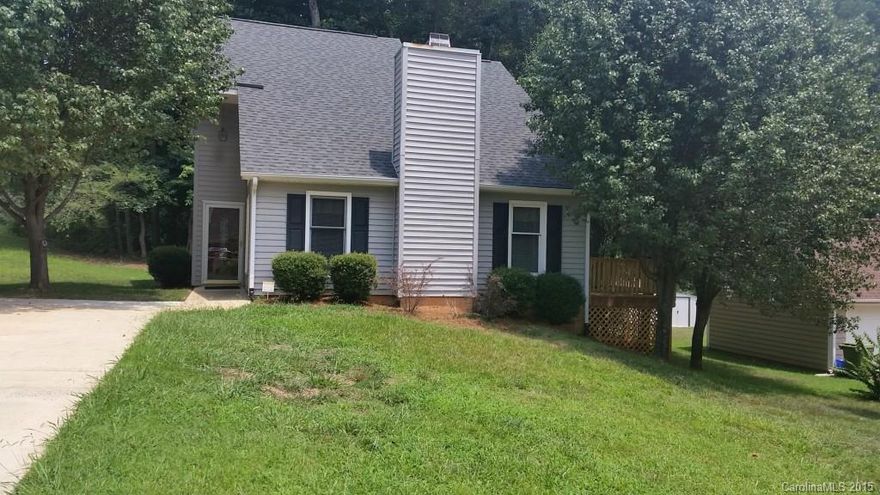 This pretty contemporary has new huge deck for your grill and entertaining, Corian counters in kitchen with lots of counter space, new laminate floors downstairs, new porcelain tile in both baths, new custom built vanity in master bath, beautiful crown moldings in Greatroom and Master. Soaring stone fireplace with gas logs. Great corner lot with storage,