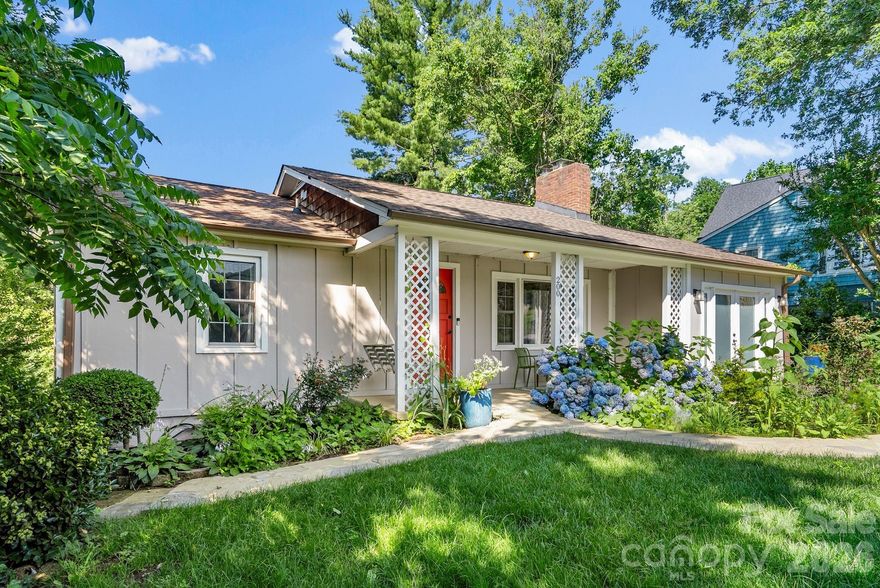 This sweet Kenilworth cottage was completely renovated—down to the studs—three years ago. Open-concept kitchen, dining and living area, plus a converted garage that opens to a rear deck with beautiful western views. The wood-burning fireplace in the living room is perfect for cozy nights and rainy days. The sunroom off the kitchen is perfect for plants and also opens to the upper rear deck. A newly renovated bathroom with a barn door supports the two main-level bedrooms. Accents throughout the house, including one wall in the living room and the barn doors, were done with reclaimed barn siding. The lower level was completely renovated, creating a bedroom, bathroom, bar area and open area with double doors to the backyard and firepit area. Potential for homestay rental (buyer to confirm with City of Asheville). Art studio, rec room, and office space are all options for this flexible space.