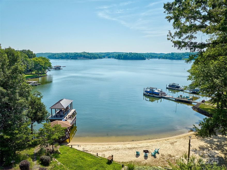 AMAZING & UNIQUE WATERFRONT HOME ON A QUIET COVE W EXPANSIVE MAIN CHANNEL VIEWS OF LAKE WYLIE!HOME HAS 2 DOCKS & 2 SANDY BEACHES.HOME OFFERS MULTIGENERATIONAL LIVING OR INCOME PRODUCING WHILE YOU LIVE THERE/HOWEVER YOUR FAMILY WANTS TO USE IT. HOME HAS 2 KITCHENS AND CAN BE BLOCKED OFF FOR SEPARATE LIVING AREAS.ENTIRE LIVING SPACE OFFERS 5 BEDRMS, 3 FULL BATHS,GREAT ROOM W/CATHEDRAL CEILINGS, COZY DEN W/ GAS FIREPLACE,2 LAUNDRY AREAS(UPSTAIRS& DOWNSTAIRS) ,ALL NEW WINDOWS ,NEW COVERED DOCK W LIFT,NEW TANKLESS WATER HEATER,NEW WHOLE HOUSE FILTRATION SYSTEM &MUCH MORE.THE LOT IS 1.36 ACRES & HAS HUGE GARAGE W CONDITIONED LIVING SPACE IN THE BACK & HEATED &COOLED STORAGE BUILDING /THEY ARE USING FOR THEIR PETS W/ WORKSHOP ON BACK AND OTHER OUTBUILDINGS.ROOM FOR ALL YOUR WATER TOYS AND STORAGE NEEDS.THERE IS ALSO A  GARDEN.COMMUTE TO CHARLOTTE,ROCK HILL &AIRPORT. LOCATED IN CLOVER SCHOOL DISTRICT. COME ENJOY THE WATERFRONT DREAM! SELLERS WOULD LIKE TO OFFER THE HOME AS IS NO KNOWN DEFECTS.