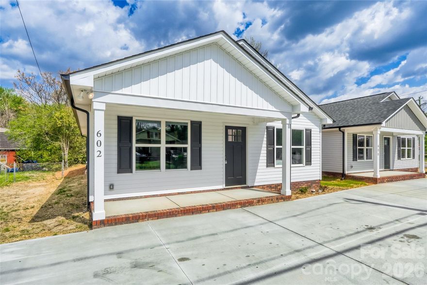 Don’t miss this brand-new construction just minutes from vibrant downtown Kannapolis! This charming home offers a welcoming covered front porch, low-maintenance exterior, and durable vinyl flooring throughout. The bright, open floor plan features 3 spacious bedrooms and 2 full baths, including a private primary suite with a walk-in closet and en-suite bath with dual vanities. A generous laundry room and convenient mudroom add everyday functionality, while modern finishes throughout create a fresh, move-in ready feel. Enjoy stylish, low-maintenance living in a growing area close to shopping, dining, and entertainment.