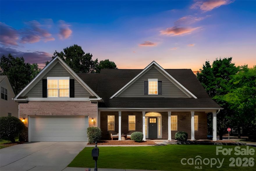Beautiful home featuring a spacious primary suite on the main level. Step inside from the large covered front porch into a stunning two-story foyer filled with natural light from abundant windows. The formal dining room showcases elegant crown molding, wainscoting, and a stylish chandelier. The inviting living room is ideal for relaxing or entertaining, highlighted by a vaulted ceiling and cozy gas log fireplace. The kitchen opens seamlessly to the living area and includes a large bar area, gas range, double stainless steel ovens, and built-in microwave. The spacious breakfast area overlooks the private, tree-lined backyard. The main-level primary suite offers a tray ceiling with ceiling fan and a charming bay window with peaceful backyard views. The luxurious primary bath features dual vanities, a large soaking tub, and separate shower. A secondary bedroom on the main floor offers neutral décor and convenient access to a full bath. Upstairs, you’ll find a generous guest bedroom, open loft area, and a versatile bonus room perfect for an entertainment or recreation space. Residents enjoy exceptional neighborhood amenities including two pools, walking trails, recreation areas, playgrounds, basketball courts, tennis courts, and pickleball courts.