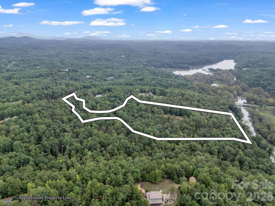 Located in the beautiful North Highland Farms section of the Lake Adger Community, this +/-12.63 acre tract has an exceptionally flat topography that sets the stage for a scenic gravel driveway leading to a highly desirable build-site. With a 4BR septic system already installed, you can start your dream build right away. Take advantage of the private setting, ideal location, and usability of your private piece of mountain paradise here at Lake Adger. With plenty of outdoor recreation, horse trails, and a community dock at your fingertips, capitalize on this rare opportunity and schedule your private showing today.