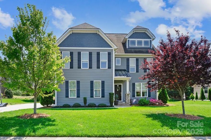 Incredible Value in Sought-After Abbington– Priced $100K Below Community Average! Don’t miss this rare opportunity to own a beautifully maintained 4-bedroom, 3-bath home offering luxury, space, and unmatched convenience in one of Harrisburg’s most desirable neighborhoods. Step inside to discover an inviting open-concept layout centered around a chef-inspired kitchen featuring granite countertops, stainless steel appliances, a gas cooktop with vent hood, and a large center island-perfect for entertaining and everyday living. The spacious, sunlit living room with a cozy gas fireplace flows seamlessly from the kitchen, creating a warm, welcoming space for family and friends. Ideal for multi-generational living or guests, the main-level bedroom with full bath offers both privacy and flexibility. Upstairs, the luxurious primary suite boasts a spa-like en suite bath and a generous walk-in closet. A versatile bonus room provides the perfect space for a home office, playroom, or media area. Enjoy the outdoors on your covered back porch, overlooking a beautifully landscaped yard—ideal for relaxing or entertaining. All this, plus resort-style community amenities including a pool, tennis courts, and playground. Located in the heart of the top-rated Harrisburg school district and quick access to I-85 and I-485, commuting to Charlotte and surrounding areas is effortless.  This home is also just minutes from Atrium Health Harrisburg, ensuring peace of mind with quality healthcare nearby. Exceptional value, unbeatable location, and top-tier lifestyle—this is Abbington living at its finest. Schedule your tour today!