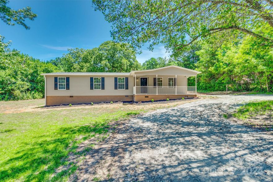 Nestled in a rural setting, this three-bedroom, two-bathroom updated ranch home offers a perfect blend of modern comfort and country charm. Situated 1.64 acres, the property offers  an updated like new condition. It is move in ready with lots of new features: a new roof, new siding, and a spacious new deck perfect for outdoor relaxation. Inside, the home features new light fixtures, appliances, toilets, and bathroom fixtures, as well as fresh flooring, carpet, and doors throughout. Clean as a whistle and brimming with updates, this home promises a peaceful and worry-free living experience. NO HOA.